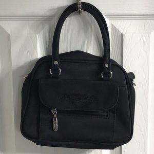 Black handbag with small flower stitching on front